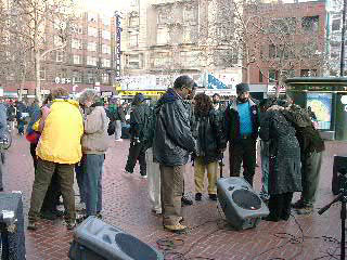 Praying with people at U.N. Plaza